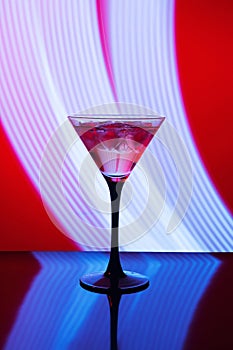 Martini glass and abstract light