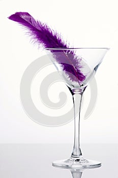 Martini glass with purple feather