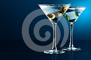 Martini glasses on blue background