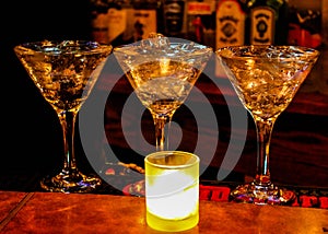 Martini Glasses Lit by Candle