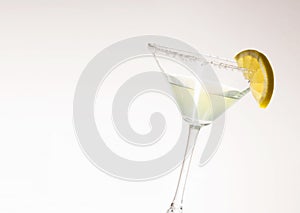 Martini with lemon wedge and sugar rim