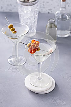 Martini with olive and salami garnishes