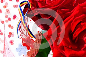 Martisor with Romanian tricolor elements, red roses and decorative holiday background. Moldavian and Romanian spring and love