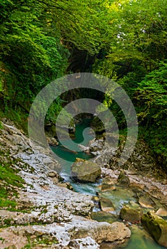 MARTVILI, GEORGIA: Abasha River with azure water in Martvili Canyon on a summer day.