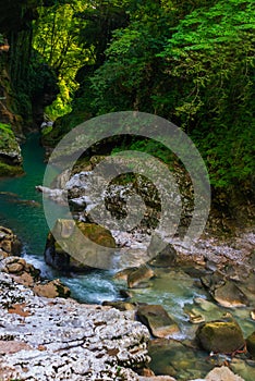 MARTVILI, GEORGIA: Abasha River with azure water in Martvili Canyon on a summer day.