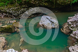 MARTVILI, GEORGIA: Abasha River with azure water in Martvili Canyon on a summer day.