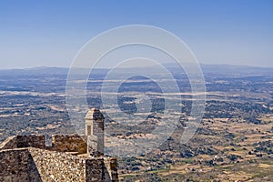 Marvao Castle walls and sentry box with Alentejo landscape.