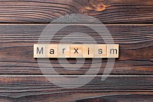 marxism word written on wood block. marxism text on table, concept