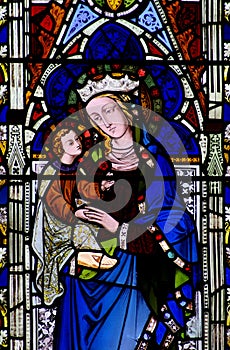 Mary with baby Jesus in her arms (stained glass)