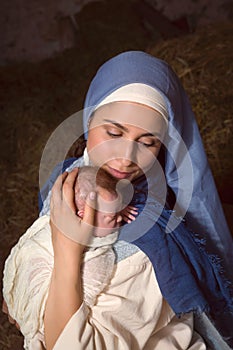 Mary hugging baby Jesus