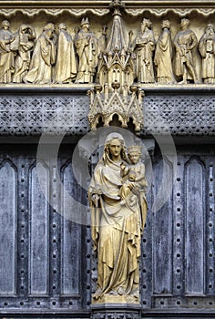 Mary and Jesus statue on the facade of a church