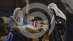 Mary And Joseph with baby Jesus in barn