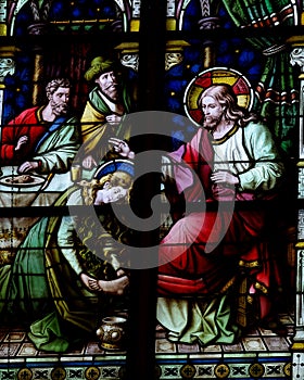 Mary Magdalene washing the feet of Jesus (stained glass) photo