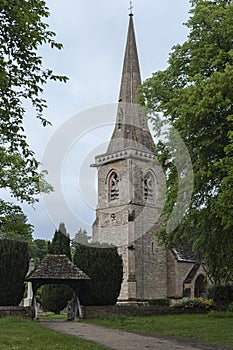 Mary`s Church with graveyard in the village of Lower Slaughter, Cotswolds, Gloucestershire, England, UK