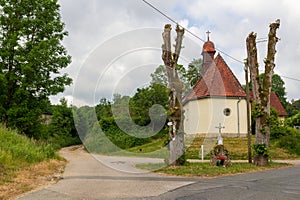 Marys chapel and hiking path in village Hundsdorf near Obertrubach, Franconian Switzerland, Bavaria, Germany