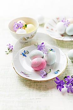 Marzipan Easter eggs on vintage plates and in cups