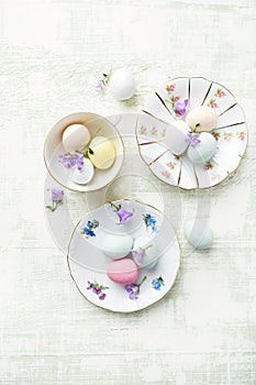 Marzipan Easter eggs on vintage plates and in cups
