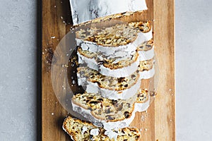 Marzipan Stollen cake with icing sugar, sliced