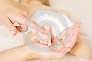 Masage newborn baby foot photo