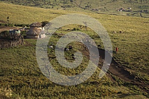 Masai village in Ngorongoro crater. Small Masai huts in African savanna, Tanzania