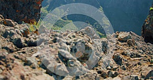 Masca Gorge or Barranco de Maska from the peak of the mountain peak. Tenerife. Rocky mountains in the foreground