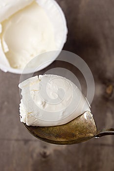 Mascarpone cheese in an old spoon