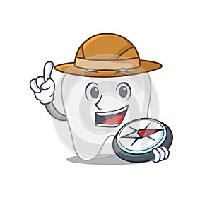 Mascot design concept of tooth explorer using a compass in the forest