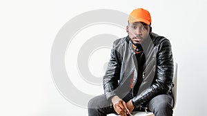 Masculine fashion man leather jacket orange cap