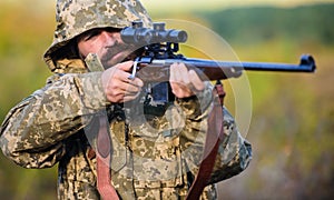 Masculine hobby activity. Hunting season. Guy hunting nature environment. Man bearded hunter with rifle nature