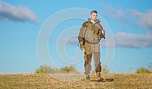 Masculine hobby activity. Hunting weapon gun or rifle. Man hunter carry rifle blue sky background. Experience and