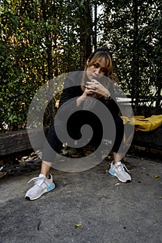 Masculinely sitting on the log bench