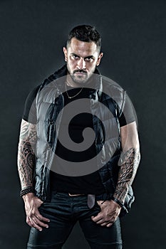 Masculinity and fashion concept. Tattoo brutal attribute. Man confident unshaven brutal appearance tattooed arms