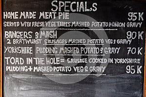 Mashed potato text on a black board menu. Puree, mash, vegetarian.