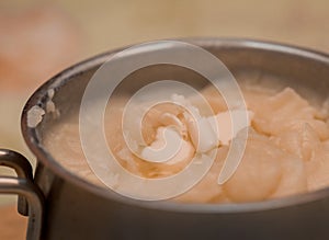 Mashed potatoes with butter in a saucepan. Food. Selective focus.