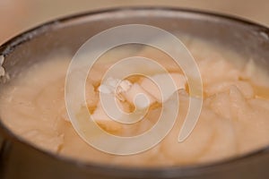 Mashed potatoes with butter in a saucepan. Food. Selective focus.