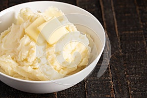 Mashed Potatoes with Butter on a Wooden Table