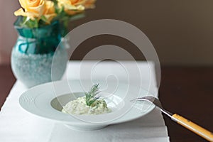 Mashed potatoes with dill in white plate