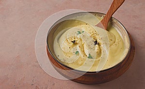 Mashed potatoes, with micro greenery and spices, homemade, on a beige table, no people, top view,