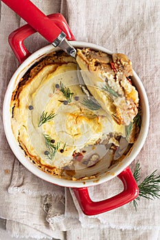 Mashed potatoes, mushrooms and seasonal vegetables casserole in baking dish. Vegetarian shepherd`s pie. Top view