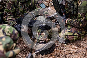 Mashine gun in hands of soldier