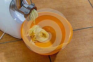 Mashing boiled potatoes for kopytka.