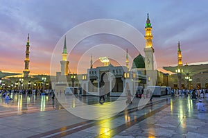 Masjid nabwi minerats and green dome in a dusky evening Madina, Saudi Arabia.