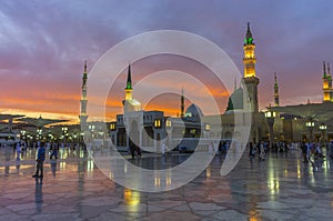 Masjid nabwi minerats and green dome in a dusky evening Madina, saudi arabia.