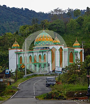 The mosque building is located in West Sumatra, precisely in the Malalak area, which has beautiful architecture and hills around photo