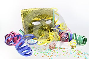 Mask, confetti and noisemakers photo