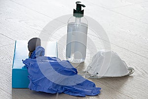 Mask, gloves and an antibacterial agent in a plastic bottle