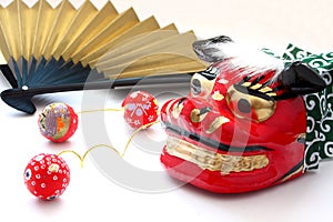 Mask for Lion dance, papercraft with colorful patterns and Folding Fan