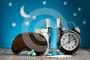 Mask, pills and alarm clock