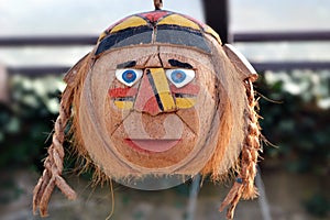 Mask of terrifying and frightening Indian from coconut