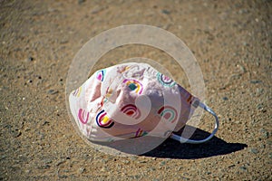 Mask for viruses and respitory illnesses for pandemic preparedness in downtown city with littered cloth around face